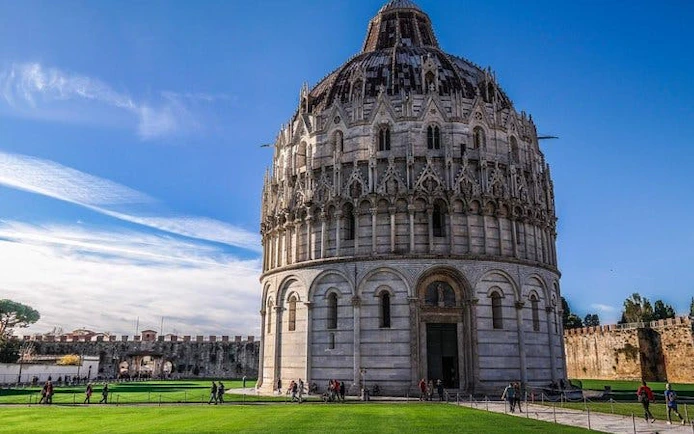 Baptistery of St. John in Pisa with tourists, part of Leaning Tower and Cathedral tour.