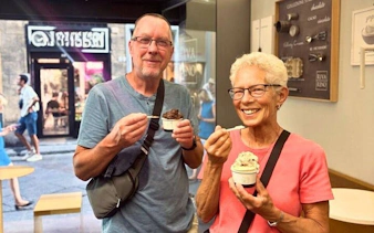 Couple enjoying gelato in a Florence shop during Oltrarno Artisan Walking Tour.