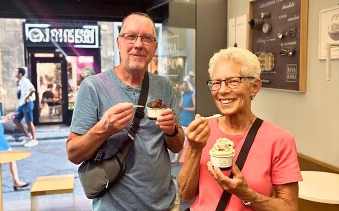 Couple enjoying gelato in a Florence shop during Oltrarno Artisan Walking Tour.