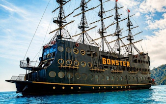 Pirate-themed boat on turquoise water during GONSTER Deluxe Pirate Boat Trip from Kemer.