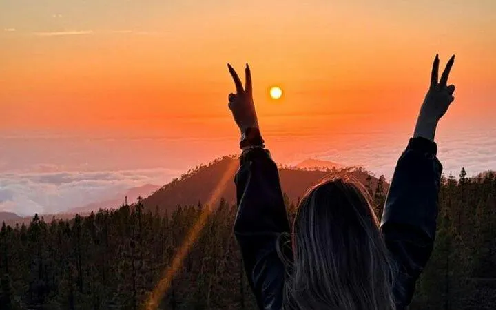 Sunset view over Teide National Park with person enjoying the scenery, Tenerife.