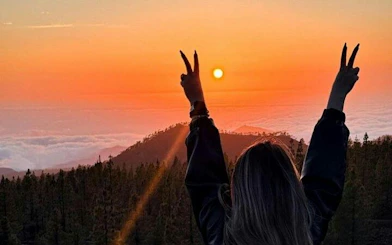 Sunset view over Teide National Park with person enjoying the scenery, Tenerife.