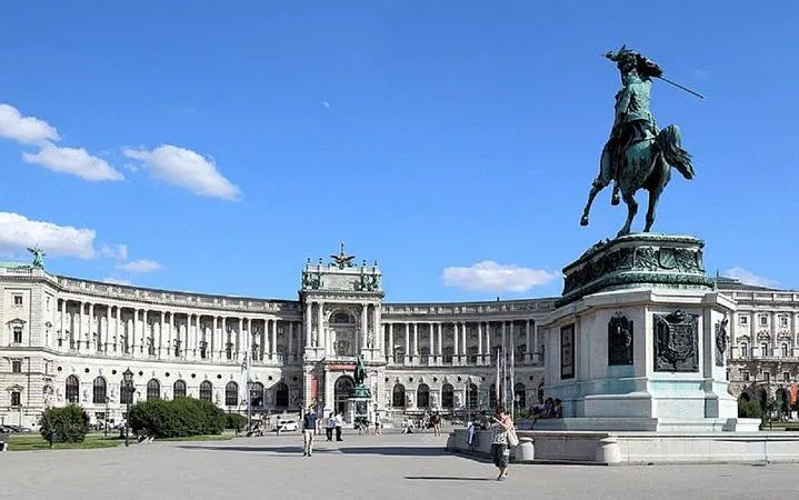 Hofburg Palace in Vienna with equestrian statue in foreground.