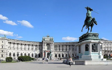 Hofburg Palace in Vienna with equestrian statue in foreground.