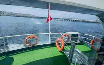 Ferry deck view with lifebuoys, heading towards Princess Islands, Istanbul.