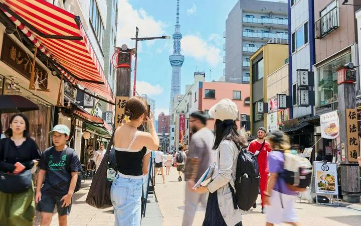 Street view in Asakusa, Tokyo with Skytree in background, location for chopstick-making workshop.