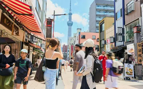 Street view in Asakusa, Tokyo with Skytree in background, location for chopstick-making workshop.