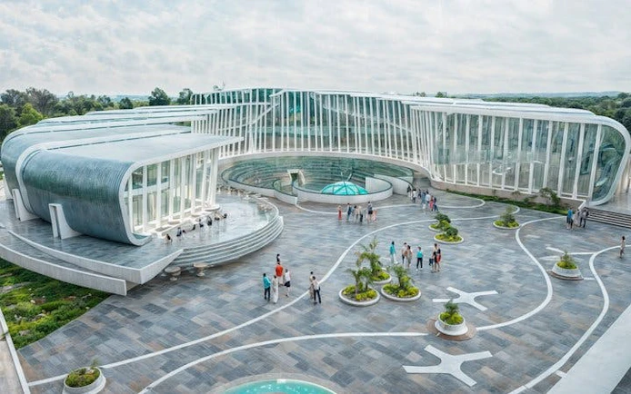 Modern architecture of Butterfly World Antalya with visitors exploring the tropical sanctuary.