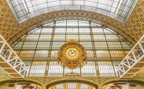 Interior of Musée d'Orsay with ornate clock, Paris Seine Walk tour.