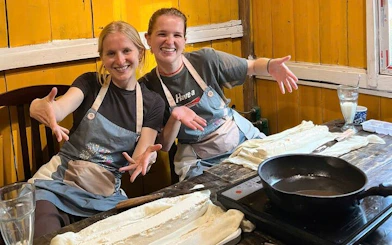 Tofu-making class in Sa Pa with participants preparing tofu using local Vietnamese ingredients.