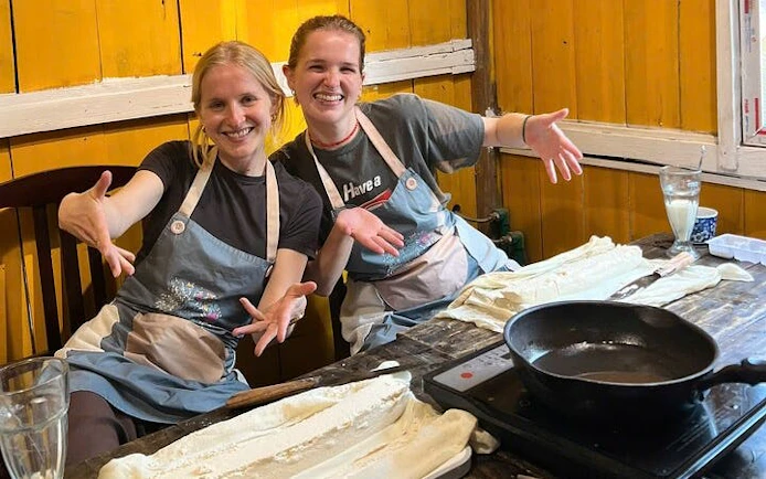 Tofu-making class in Sa Pa with participants preparing tofu using local Vietnamese ingredients.