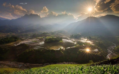 Terraced rice fields in Sapa under a setting sun, Vietnam, part of the motorbike and jungle trek tour.