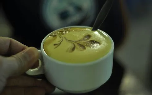 Egg coffee served in a cup during Hanoi Jeep City Tour.