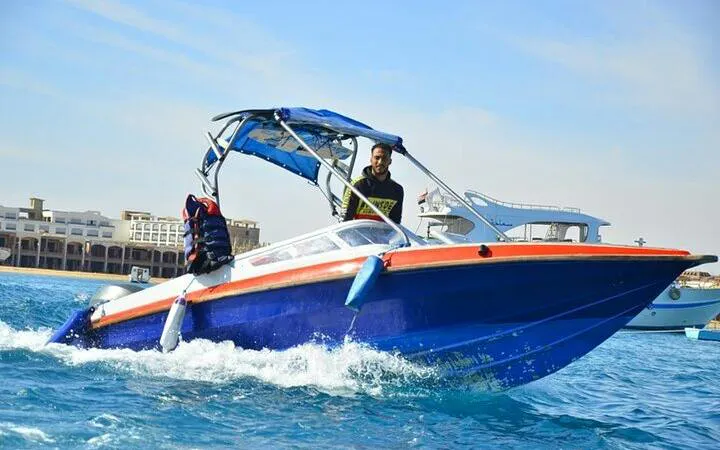 Speedboat on clear water near Hurghada, heading to Hula Hula Island.