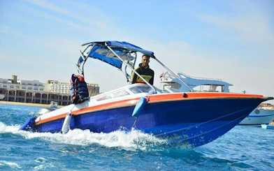 Speedboat on clear water near Hurghada, heading to Hula Hula Island.