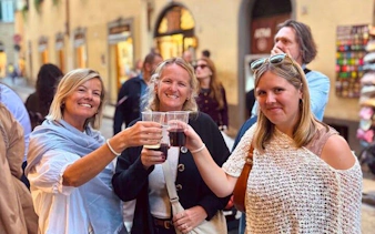 Group enjoying wine on Oltrarno Artisan Walking Tour in Florence.