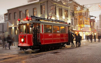 Red tram on Istiklal Avenue during Istanbul self-guided walking tour.