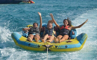 Group enjoying banana boat ride on the sea in Sharm El Sheikh.
