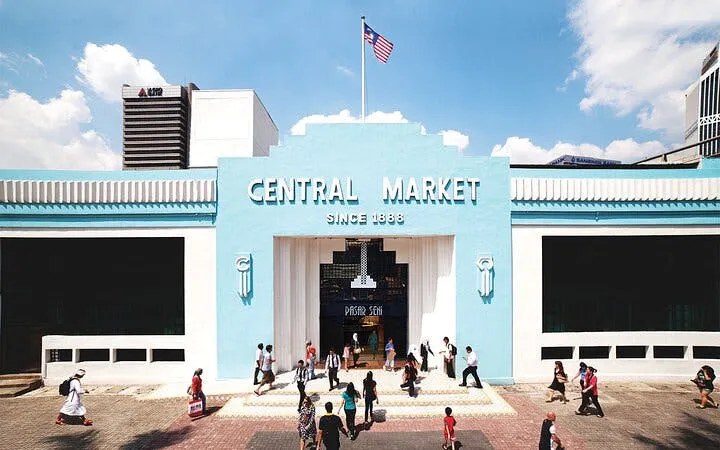 Central Market entrance in Kuala Lumpur with visitors walking nearby.