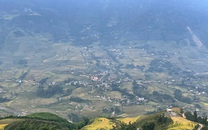 Rice terraces and village view in Sapa, Vietnam, part of a private 2-day car tour with homestay in Ta Van.