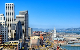 San Francisco skyline with Ferry Building and bay view, part of Gold Rush city exploration game.