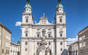 Salzburg Cathedral facade, central to music history exploration game.