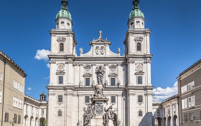 Salzburg Cathedral facade, central to music history exploration game.