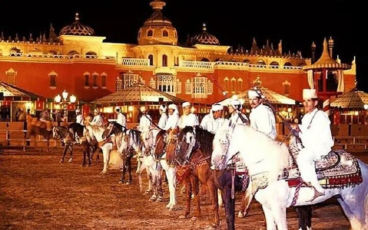 Riders in traditional attire on horses at Chez-Ali Fantasia show, Marrakesh.