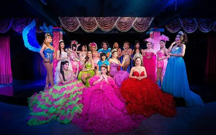 Cabaret performers in colorful costumes on stage at Blue Dragon Cabaret, Krabi.