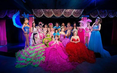 Cabaret performers in colorful costumes on stage at Blue Dragon Cabaret, Krabi.