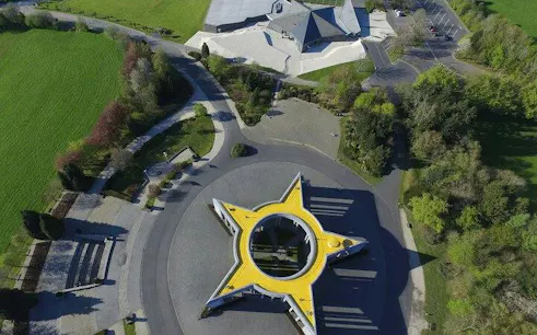 Bastogne War Museum aerial view with star-shaped memorial, part of Battle of the Bulge tour.