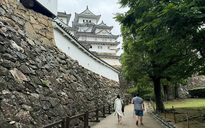 Visitors walking towards Himeji Castle, a UNESCO World Heritage site near Osaka, Japan.