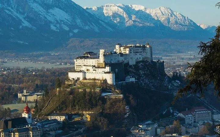 Salzburg Fortress with Alps backdrop on Munich to Salzburg day trip.