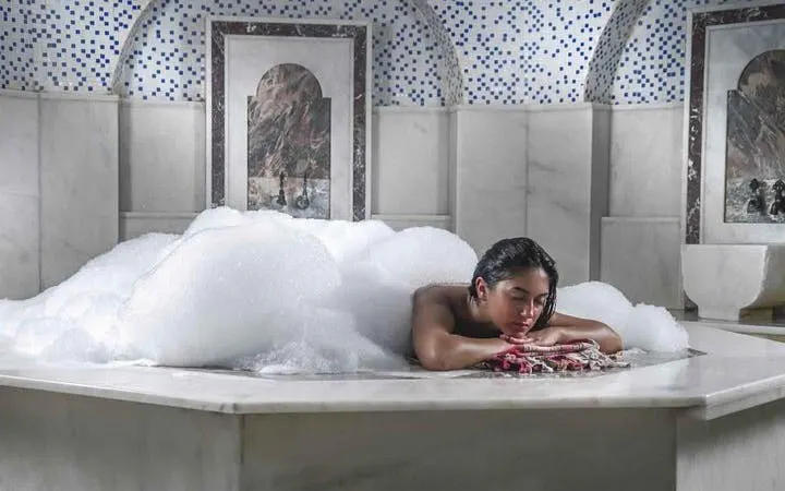 Turkish bath massage with foam in Hurghada spa.