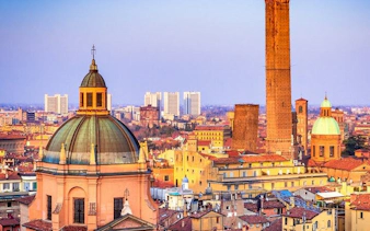 Bologna skyline with historic towers and domes, view from self-guided walking tour app.
