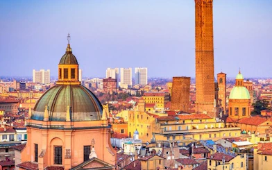 Bologna skyline with historic towers and domes, view from self-guided walking tour app.