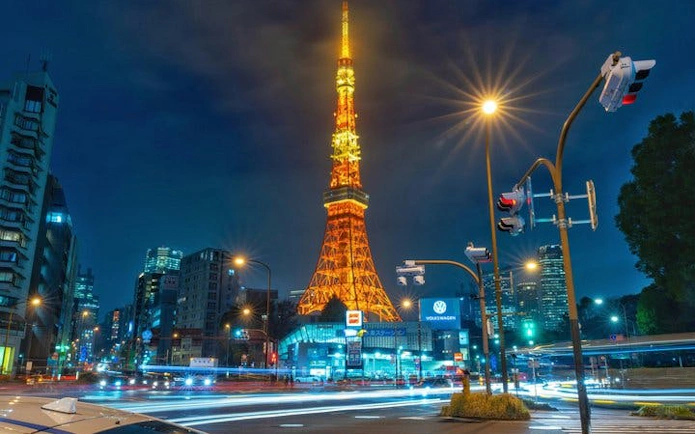 Tokyo Tower illuminated at night, view from street intersection, Tokyo Private Guided Tour.
