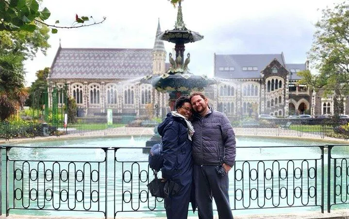 Couple in front of Peacock Fountain, Christchurch Botanic Gardens, during city tour.