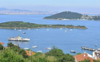 Ferry approaching Heybeliada with Buyukada in the background, Princess Islands, Istanbul.