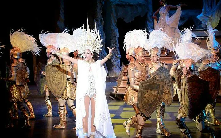 Performers in elaborate costumes on stage at Colosseum Show Pattaya.