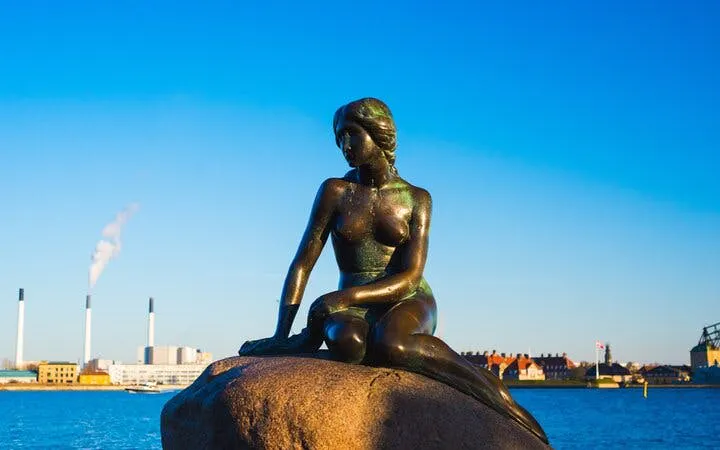 Little Mermaid statue on a rock by the waterfront in Copenhagen.