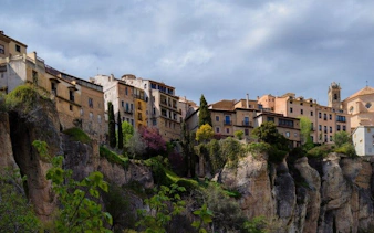 Historic cliffside houses in Cuenca, Spain, viewed during a self-guided walking tour.
