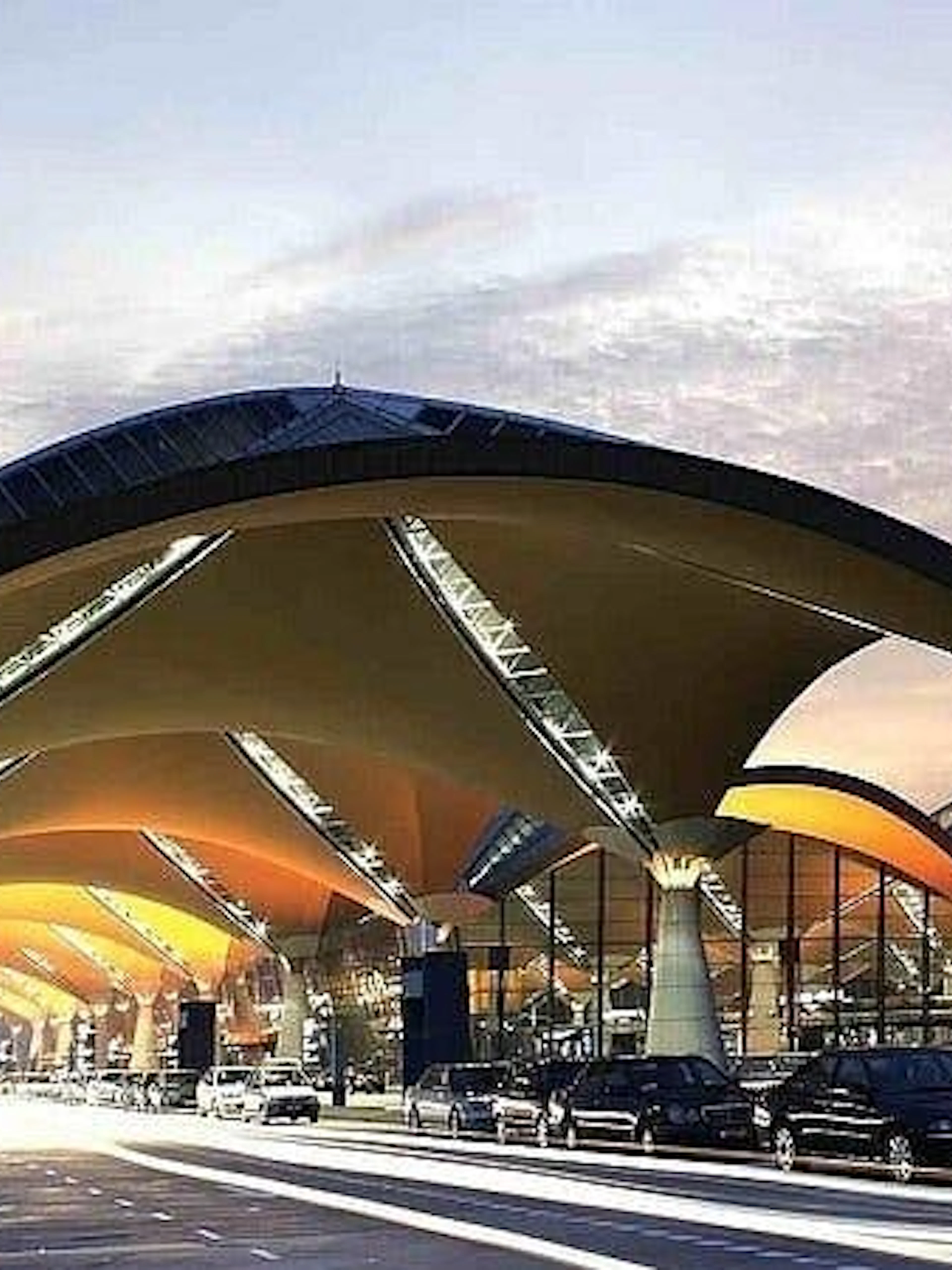 Kuala Lumpur International Airport terminal with cars for private city hotel transfer.