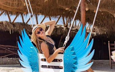 Swing with blue wings at beachside hut, Hula Hula Island, Hurghada.