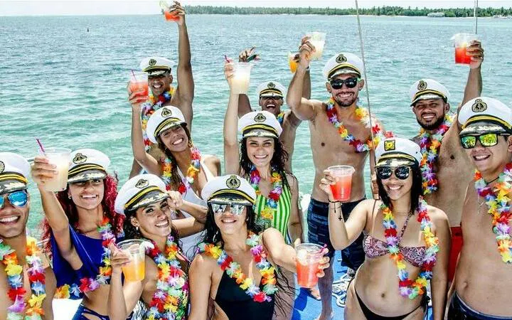 Group enjoying drinks on a yacht cruise along Punta Cana Bavaro Coast.