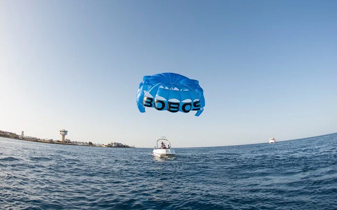 Parasailing over the Red Sea with a boat in Hurghada.