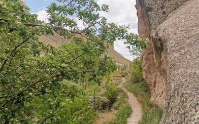 Trekking path through scenic valley with rock formations in Cappadocia.