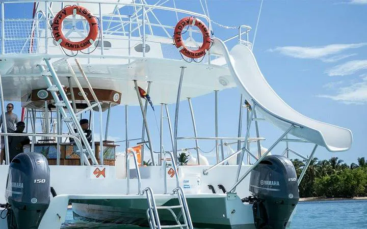 Catamaran with slide and open bar in Punta Cana, ready for snorkeling cruise.