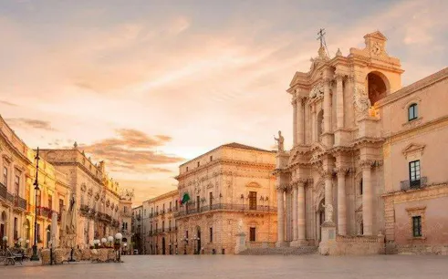 Syracuse Cathedral in Piazza Duomo during sunset, part of self-guided walking tour, Siracusa.