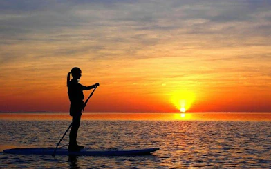 Paddleboarder at sunset on Ishigaki Island, Okinawa.